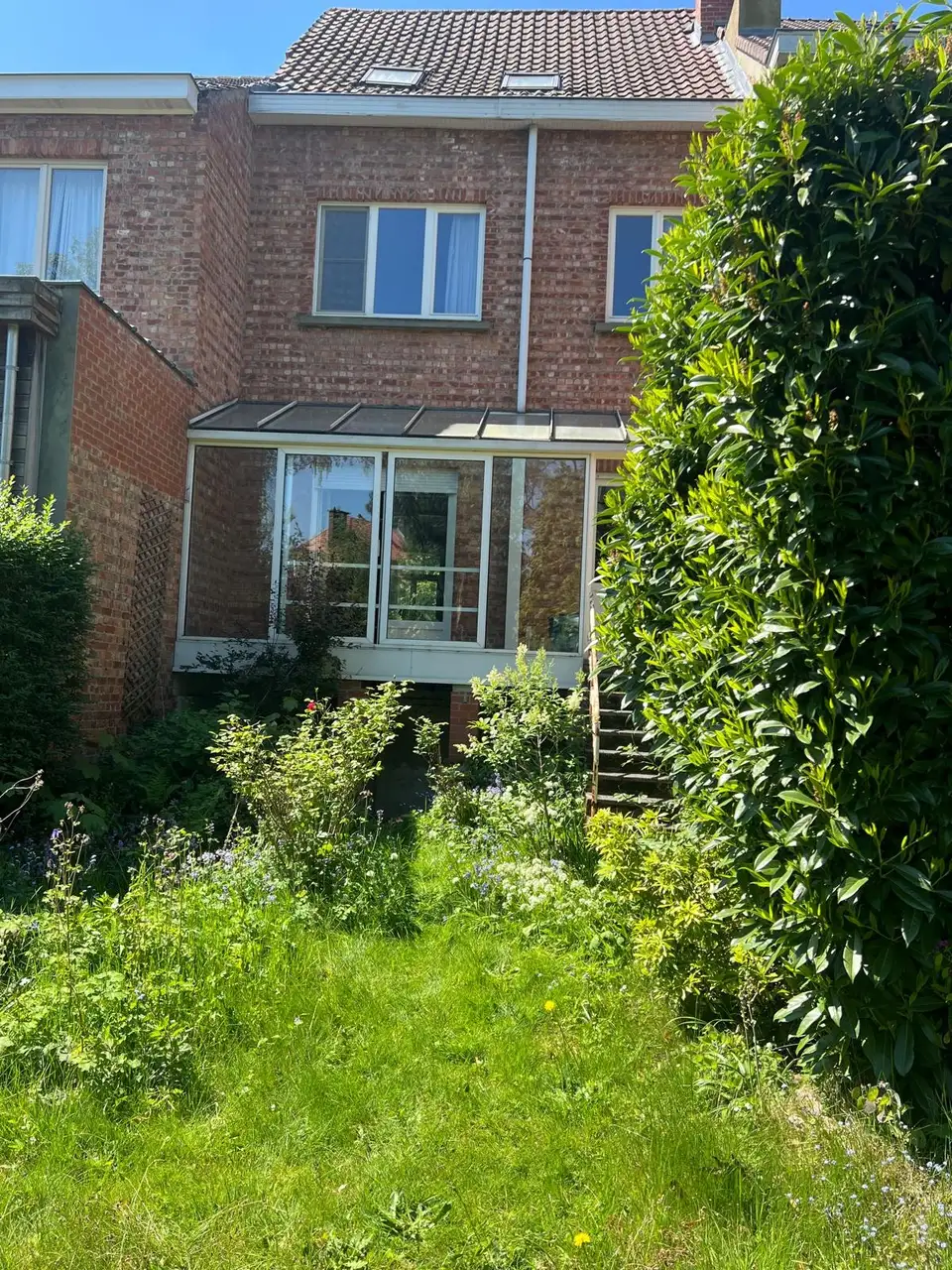 Avant : Côté jardin, extension avec grandes baies, escalier et terrasse, Woluwe-Saint-Pierre